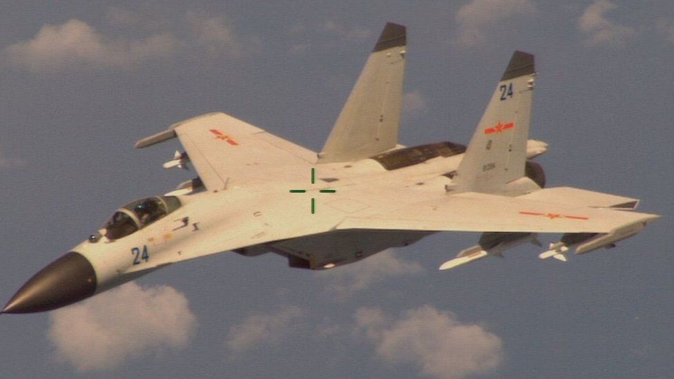 A Chinese jet fighter, as seen from a US Navy P-8 Poseidon surveillance plane in August 2014