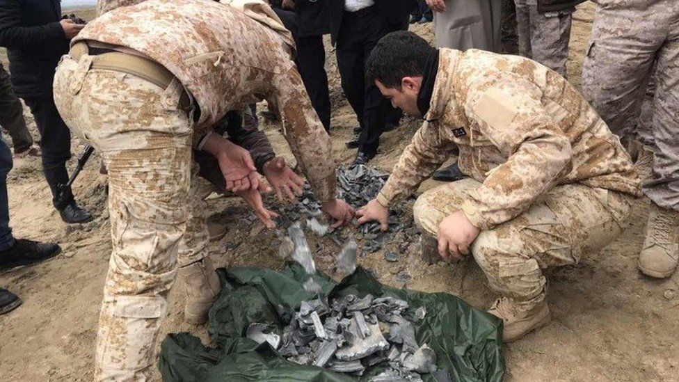 Iraqi security forces gather pieces of Iranian missile in Irbil