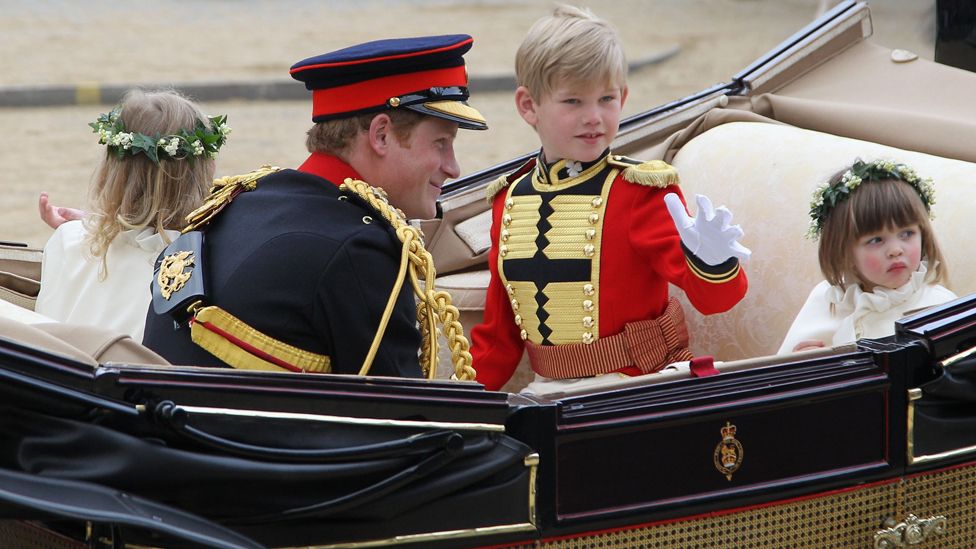 Prince Harry with pageboy Tom Pettifer and bridesmaid Eliza Lopes, right