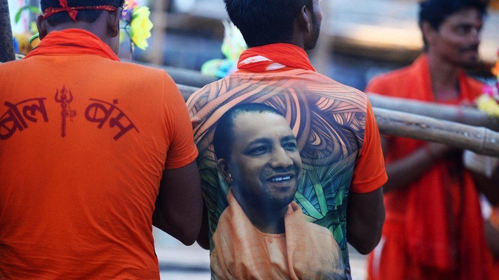 Indian man wearing a T-shirt with a photo of Uttar Pradesh chief minister Yogi Adityanath on the back