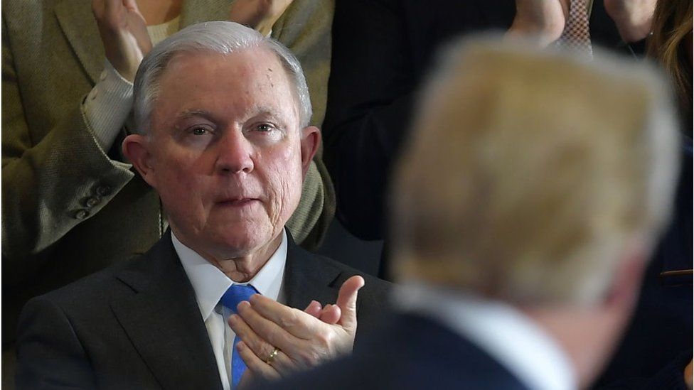 Sessions applauds Trump at a speech in 2018