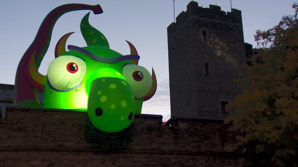 Inflatable monster on the city walls in Derry