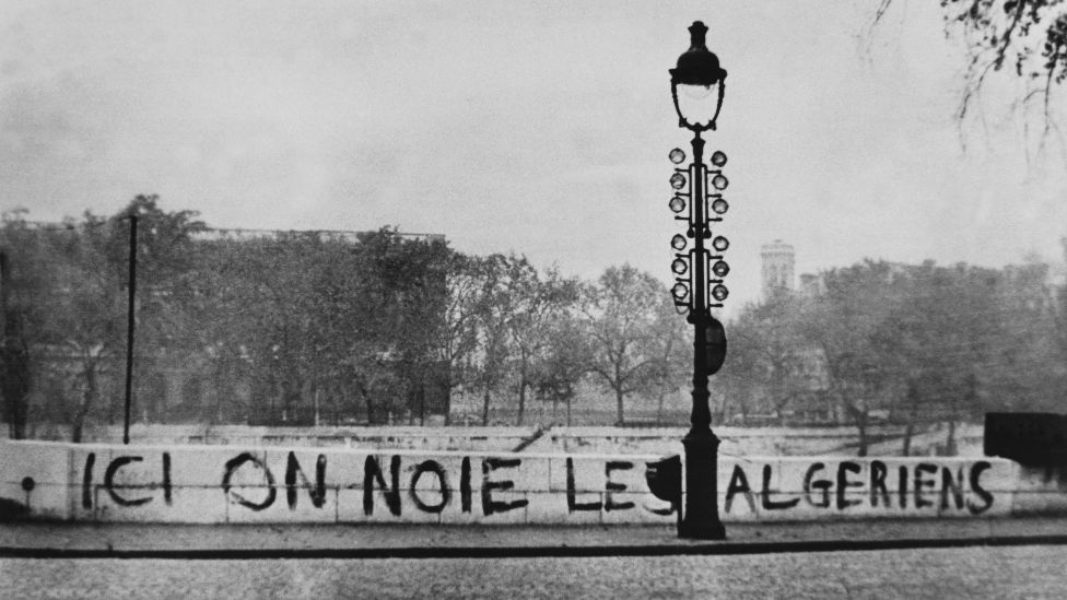 The words "Here we drown Algerians" are seen on the embankment of the Seine in Paris, France - October 1961