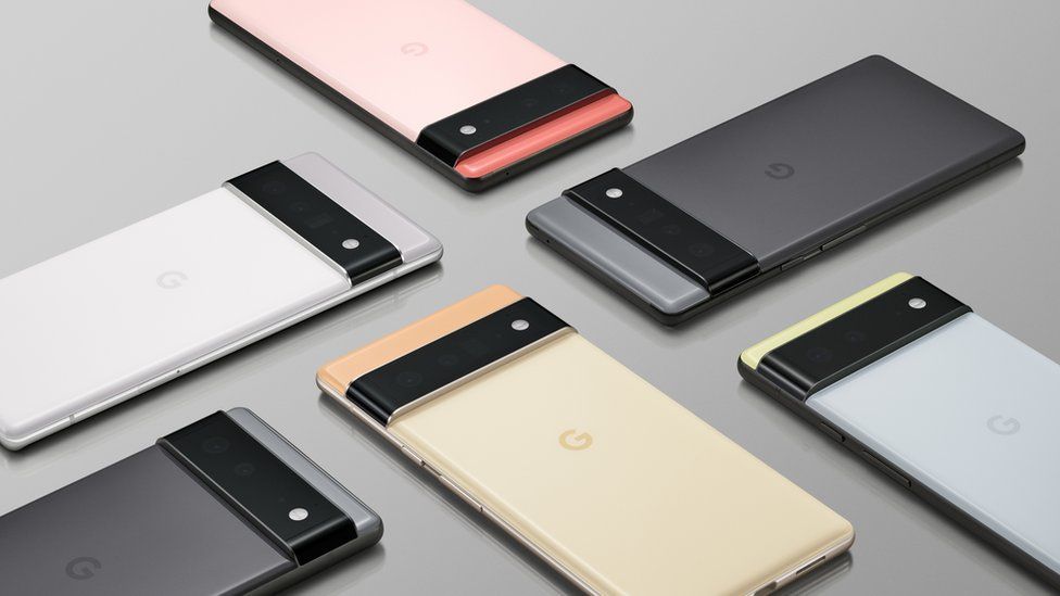 A selection of Pixel 6 and Pixel 6 Pro phones arranged in a pattern in various sizes and colours