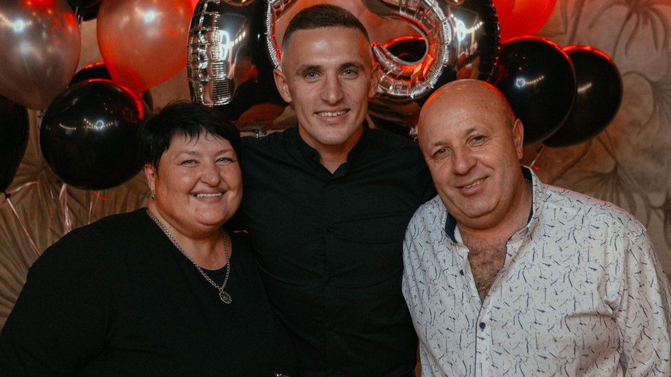 A family photo of Olha Sukhenko, her husband Igor and her son Oleksander