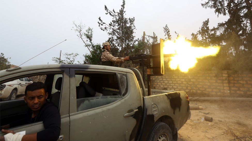 Fighters loyal to the Libyan internationally-recognised Government of National Accord (GNA) fire a heavy machine gun during clashes against forces loyal to strongman Khalifa Haftar, on May 21, 2019 in the Salah al-Din area south of the Libyan capital Tripoli