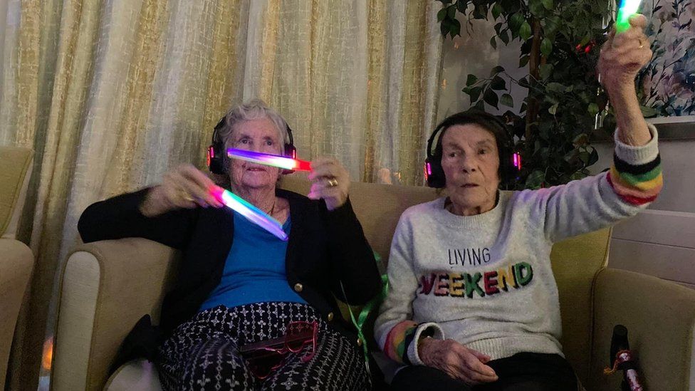 Residents with glow sticks