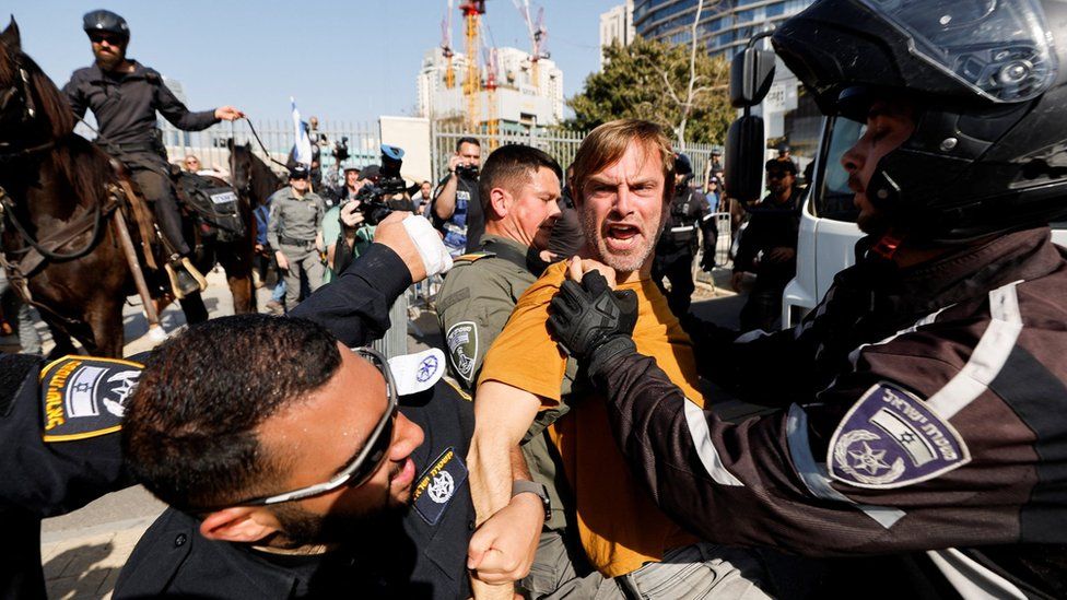 A man is detained by Israeli police during a protest against the government's contentious judicial reforms, in Tel Aviv, Israel (1 March 2023)