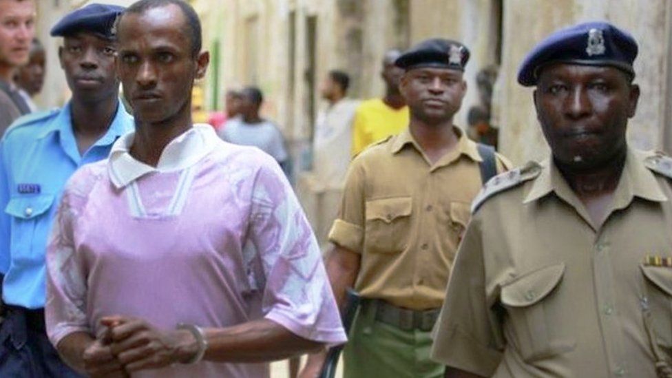 Ali Kololo, a former employee of the Kiwayu Safari Village, is escorted by police, July 2013