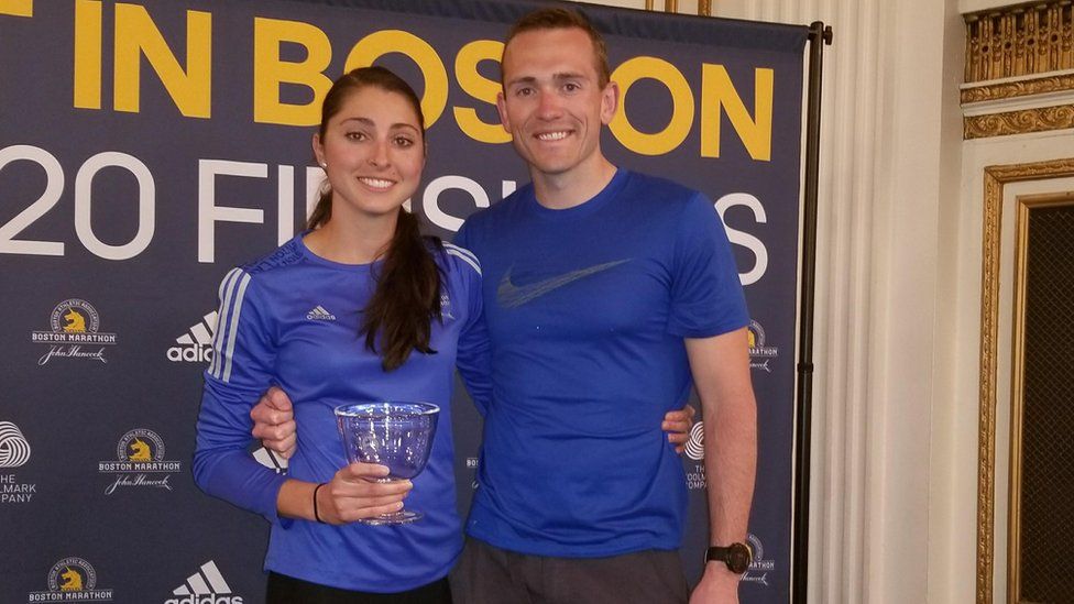 Sarah Sellers poses with her husband before Monday's marathon run