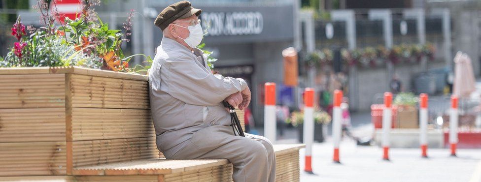 Shopper sitting on a bench in Aberdeen