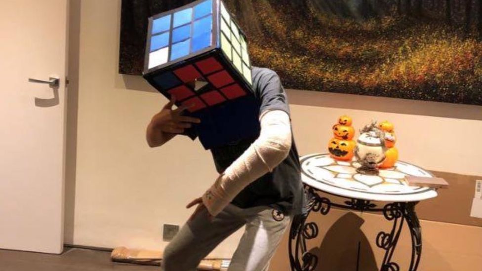 Suleman Dawood, wearing a Rubik's Cube costume