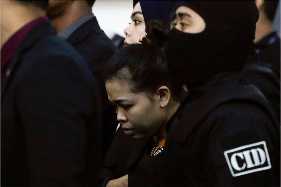 Siti Aisyah (C) of Indonesia - who is on trial for the assasination of Kim Jong-nam, the estranged half-brother of North Korea"s leader Kim Jong-un - is escorted as she revisits scene of the attack at Kuala Lumpur International Airport 2 in Sepang, Malaysia, 24 October 2017.