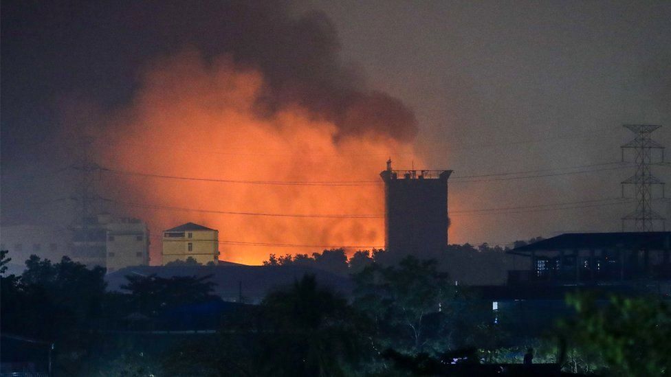 Burning Chinese-owned factories light up the industrial neighbourhood in Hlaing Tharyar, on the outskirts of Yangon, Myanmar, 15 March 2021