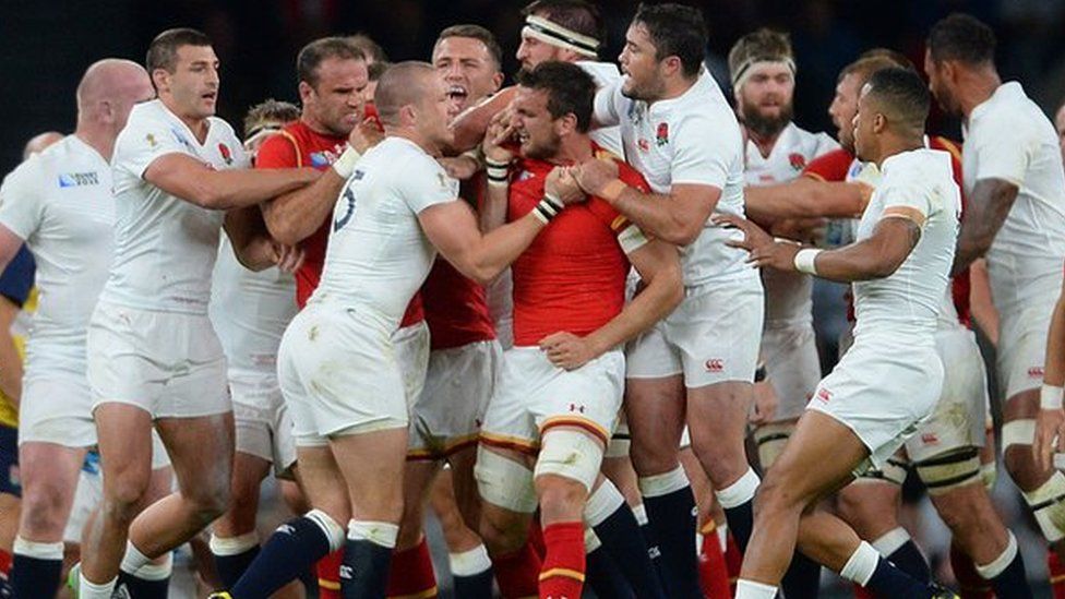 England full-back Mike Brown and Wales captain Sam Warburton scuffle during the World Cup game at twickenham