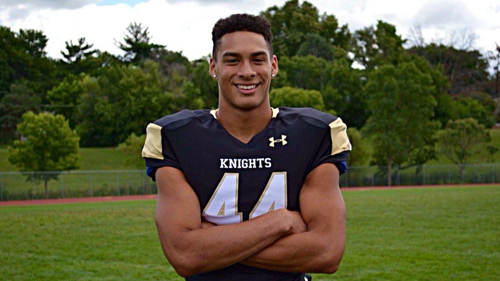 Sterling Smith (12) poses for a picture in his football uniform. Photo creds: BBC news.