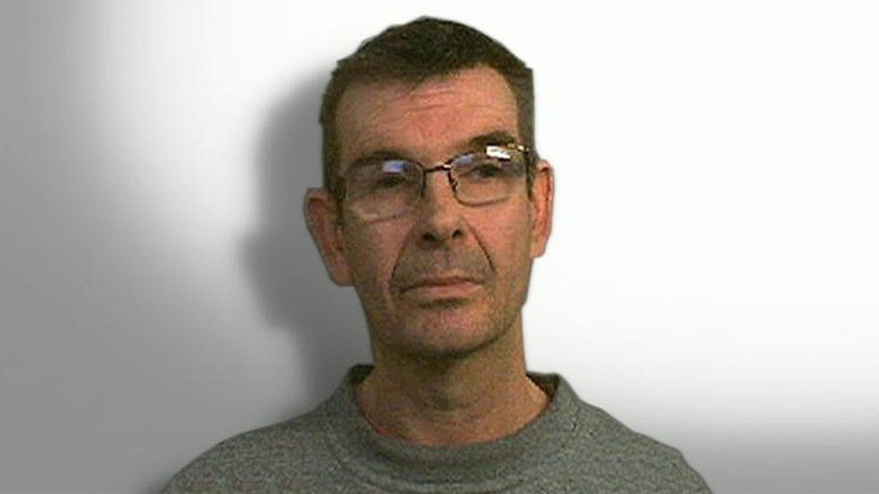 Nigel Leat mugshot. He is wearing glasses and a grey jumper