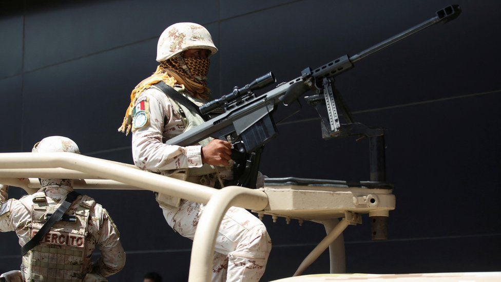 A Mexican soldier armed with a high-powered rifle