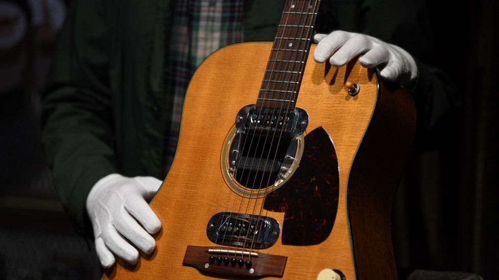 Kurt Cobain's MTV Unplugged guitar sells for $6m at auction - BBC News