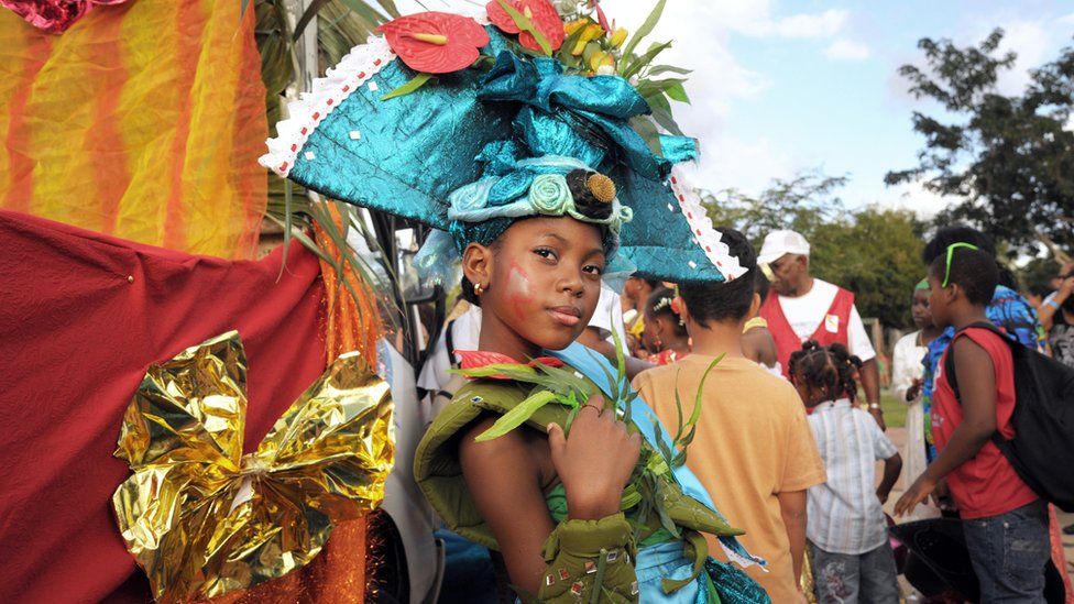 'Mini queen of Martinique" poses during carnival parade in Fort-de-France