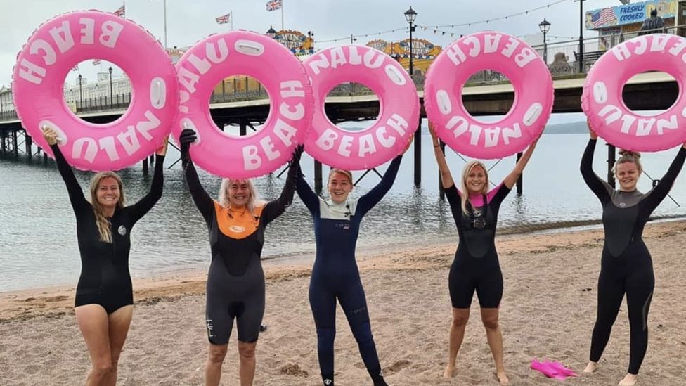 Halloween swim ends woman's yearlong Paignton Pier challenge BBC News