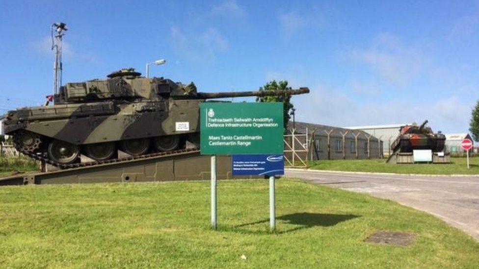 Castlemartin Range entrance with sign and tank