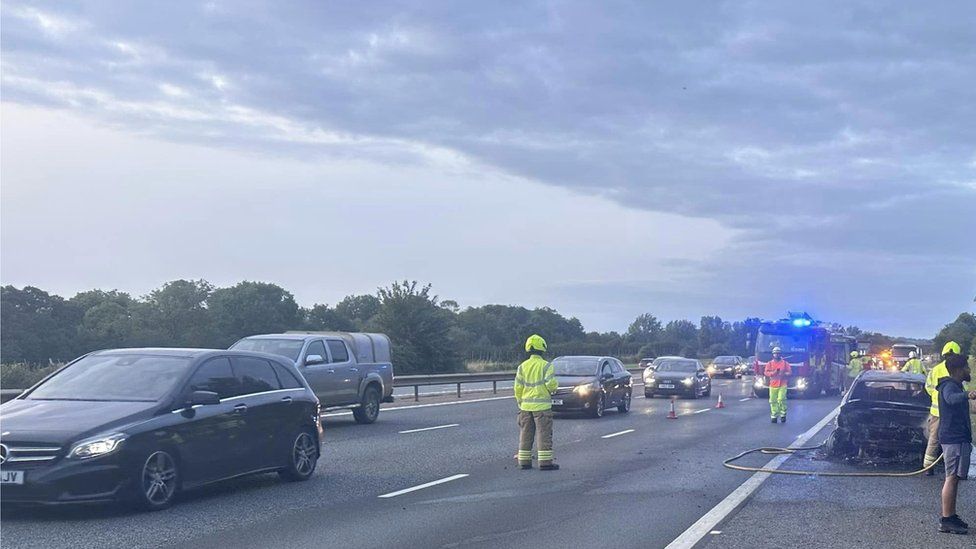 Car bursts into flames on M40 motorway hard shoulder BBC News