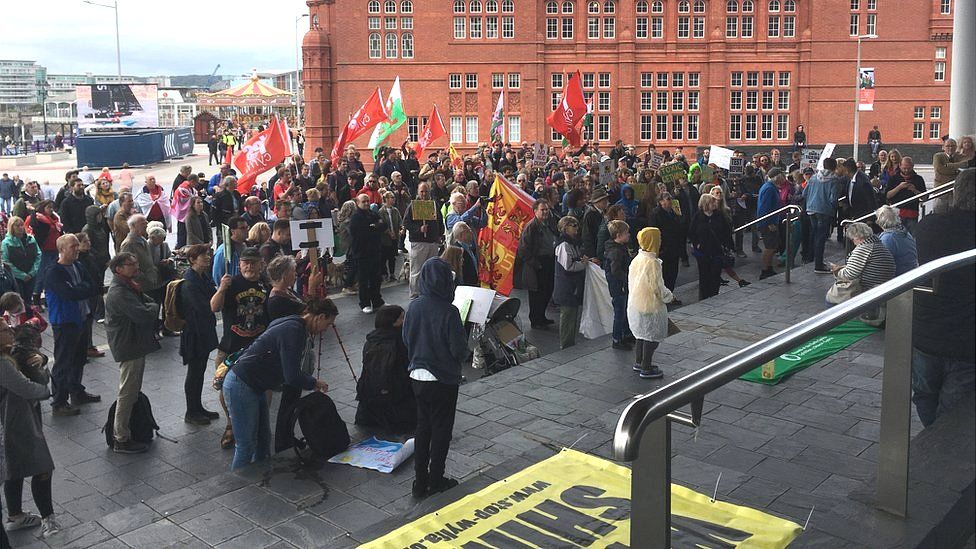 Protesters on the steps of the Senedd in Cardiff Bay