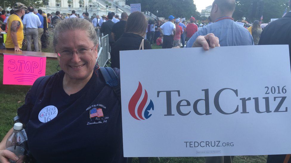 Amy Waychoff holds up her Ted Cruz sign