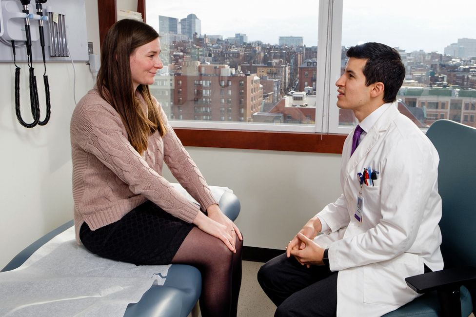Dr Joel Salinas talks to a patient