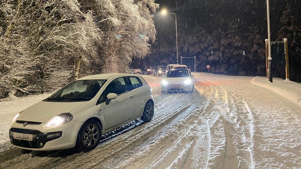 Vehicles at a standstill in the snow on the M6 in Cumbria on Saturday