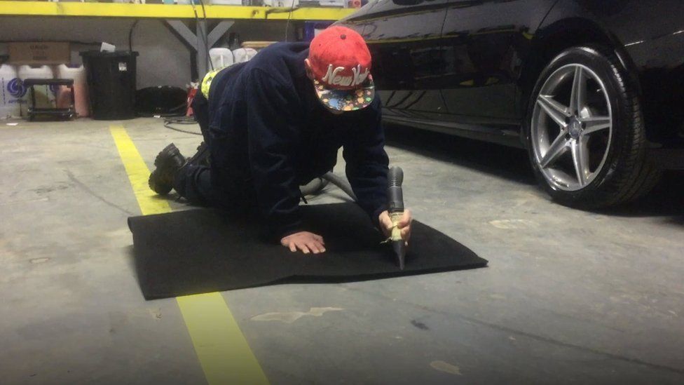 Michael doing work in garage