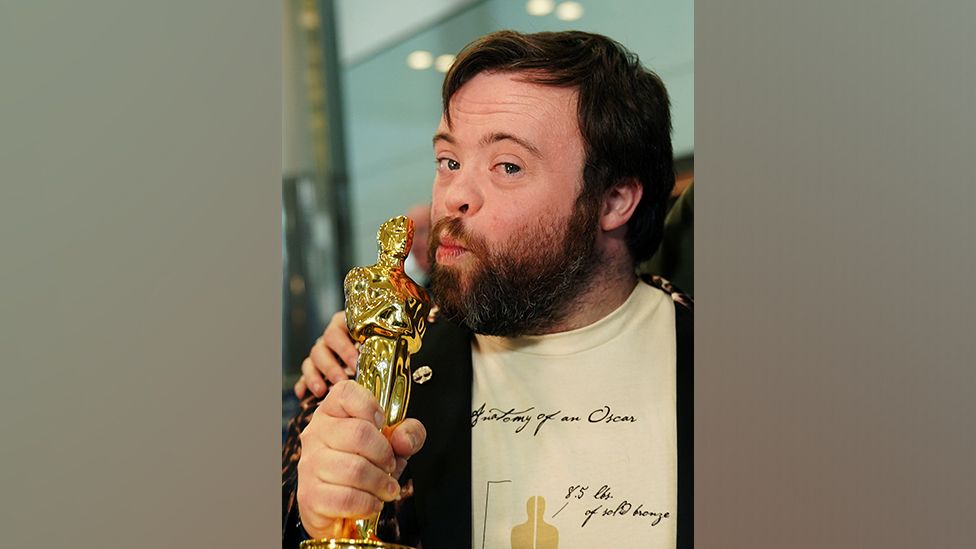 James Martin holding his Oscar