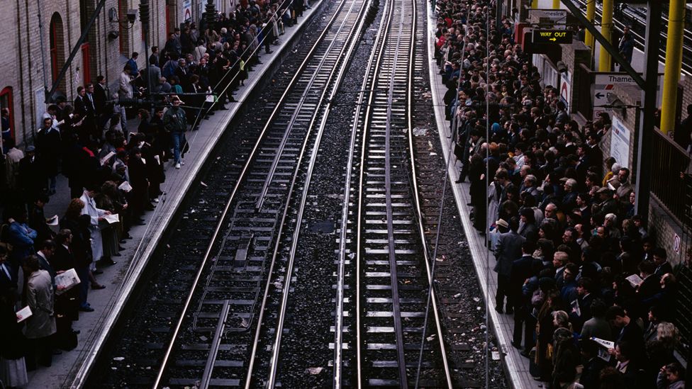 Commuters wait for a Thameslink train