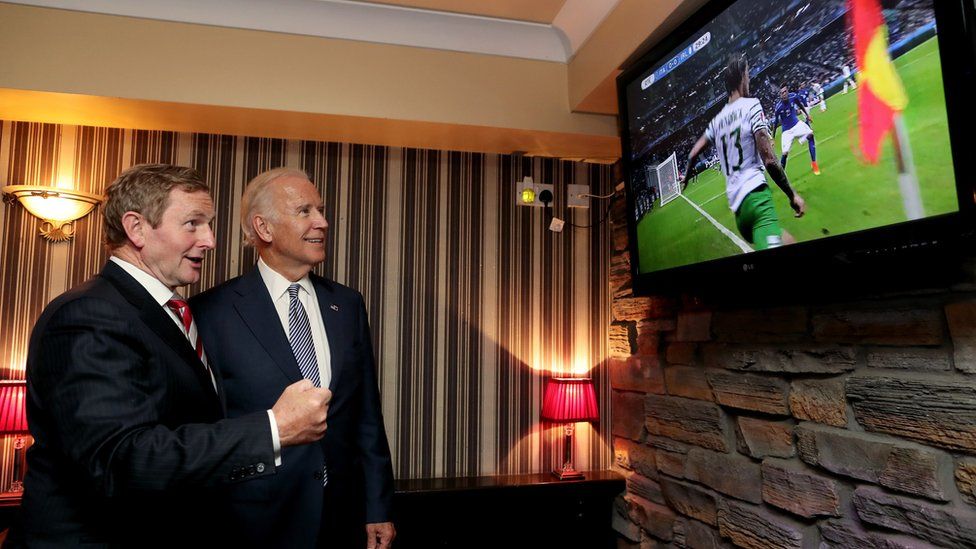 Joe Biden (right) and Taoiseach Enda Kenny watching the Ireland v Italy match in Coady"s Pub, Castlebar,