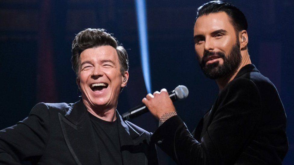 Rick Astley and Rylan Clark on stage