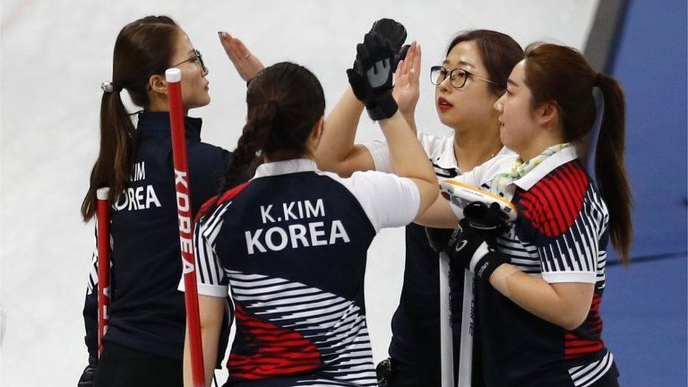 Kim Eun-jung, Kim Kyeong-ae, Kim Seon-yeong and Kim Cho-hi of South Korea celebrate after beating Olympic Athletes from Russia.