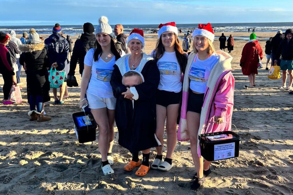 Clair Todd (second left) on the beach with her daughters Aimee, Chloe and Josie