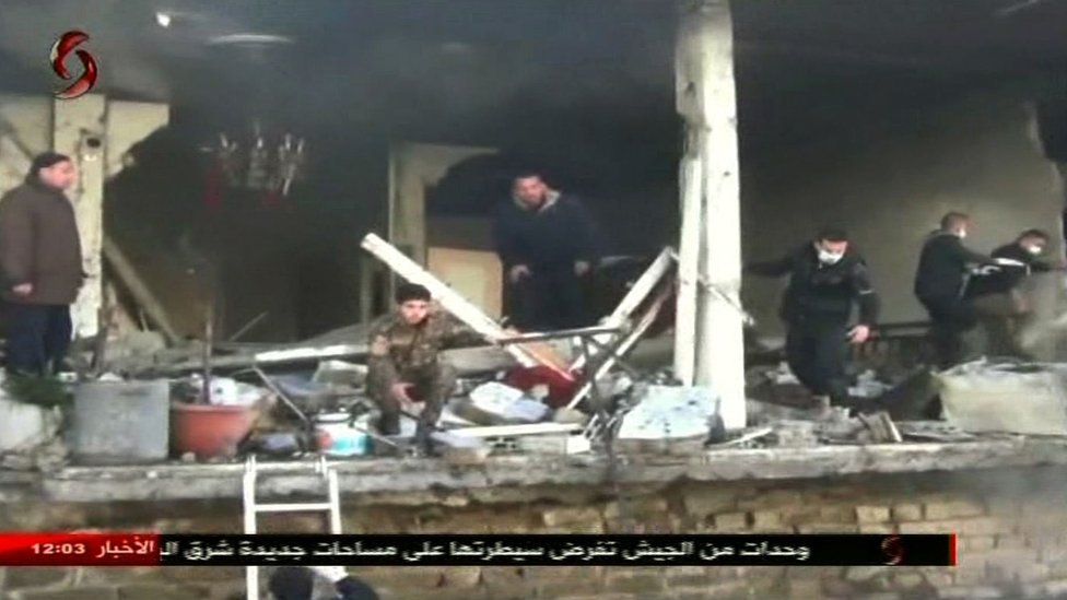 Screengrab from Al-Ikhbariya Al-Souriya TV channel on 25 February 2017 shows aftermath of Homs attack