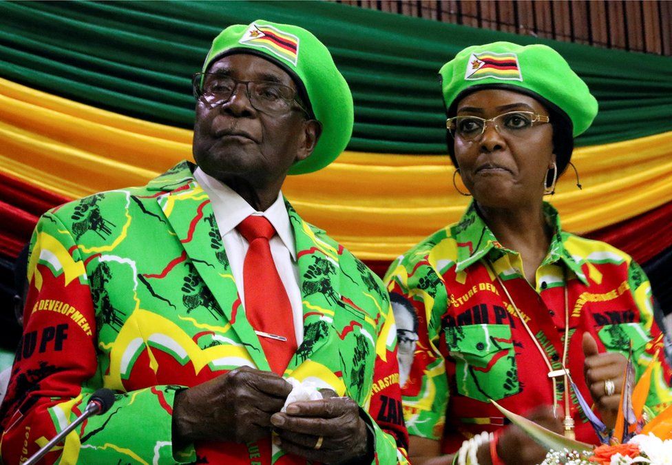 Zimbabwean President Robert Mugabe and his wife Grace attend a meeting of his ruling ZANU PF party"s youth league in Harare, Zimbabwe, October 7, 2017.