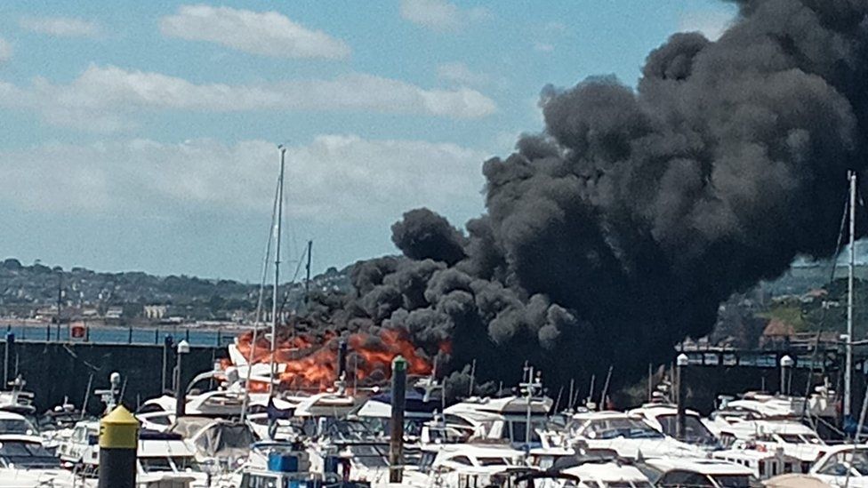 Black smoke billowing from boat