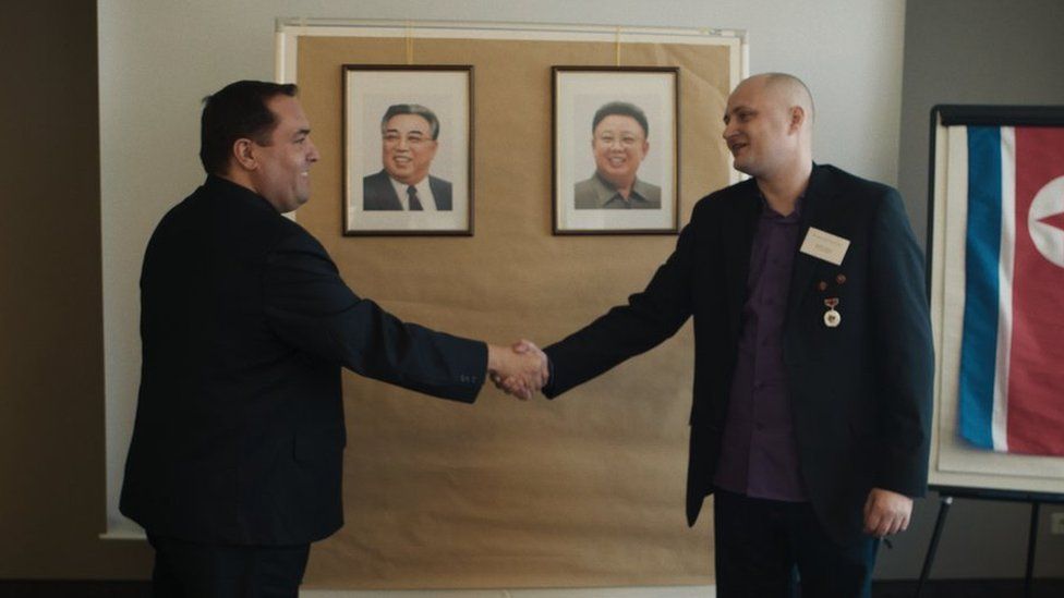Alejandro Cao de Benós and Ulrich Larsen shaking hands at a KFA meeting in Germany