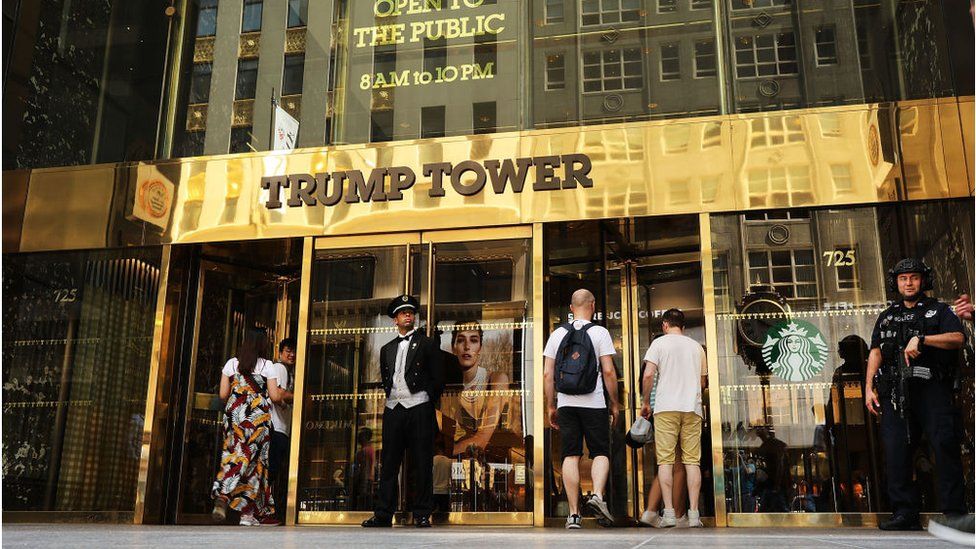 A guard stands outside of Trump Tower on Fifth Avenue in Manhattan, New York City