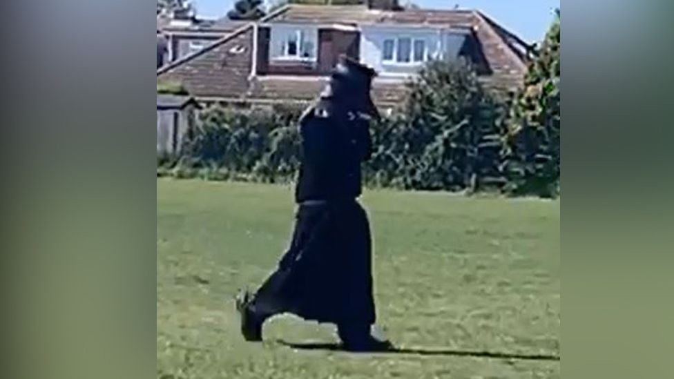 Person dressed as plague doctor