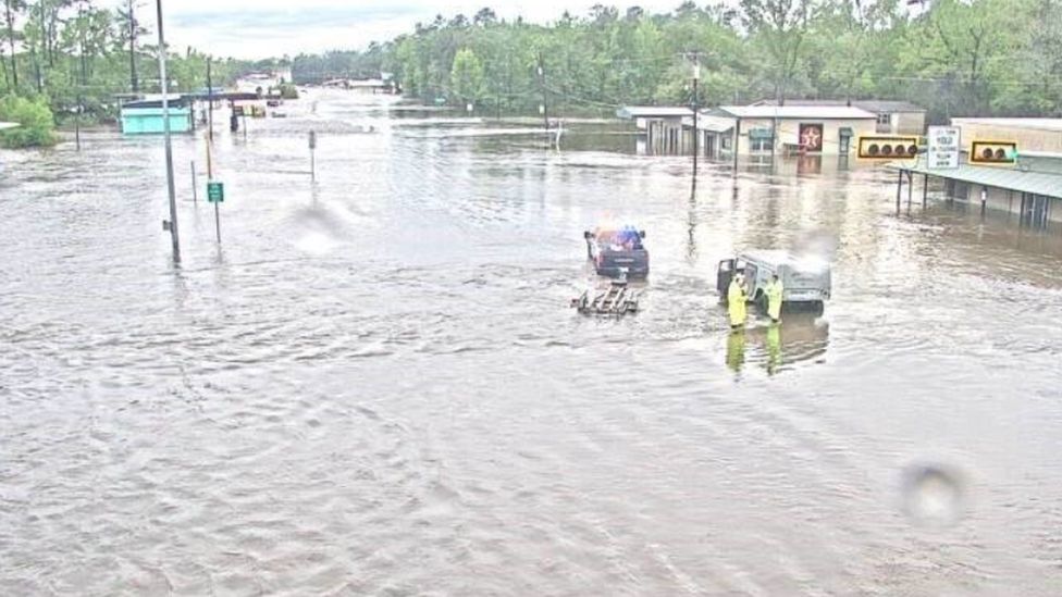 A traffic camera shows a flooded road in southeast Texas