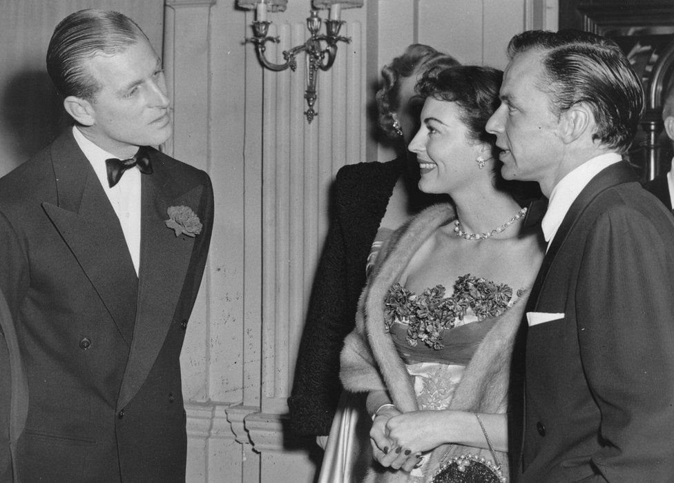 Prince Philip chatting with Frank Sinatra and his wife the actress Ava Gardner at London's Empress Club (December 1951)
