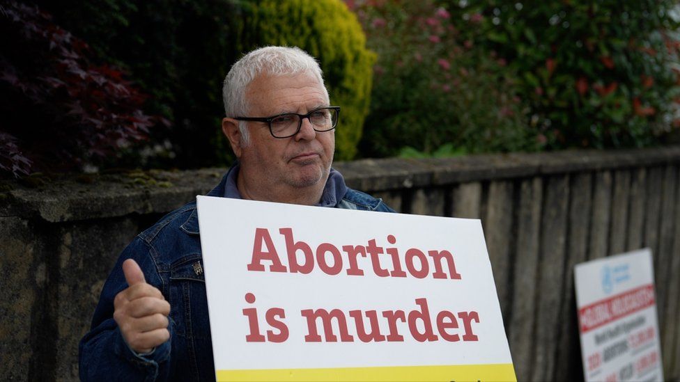 Man holding anti-abortion placard