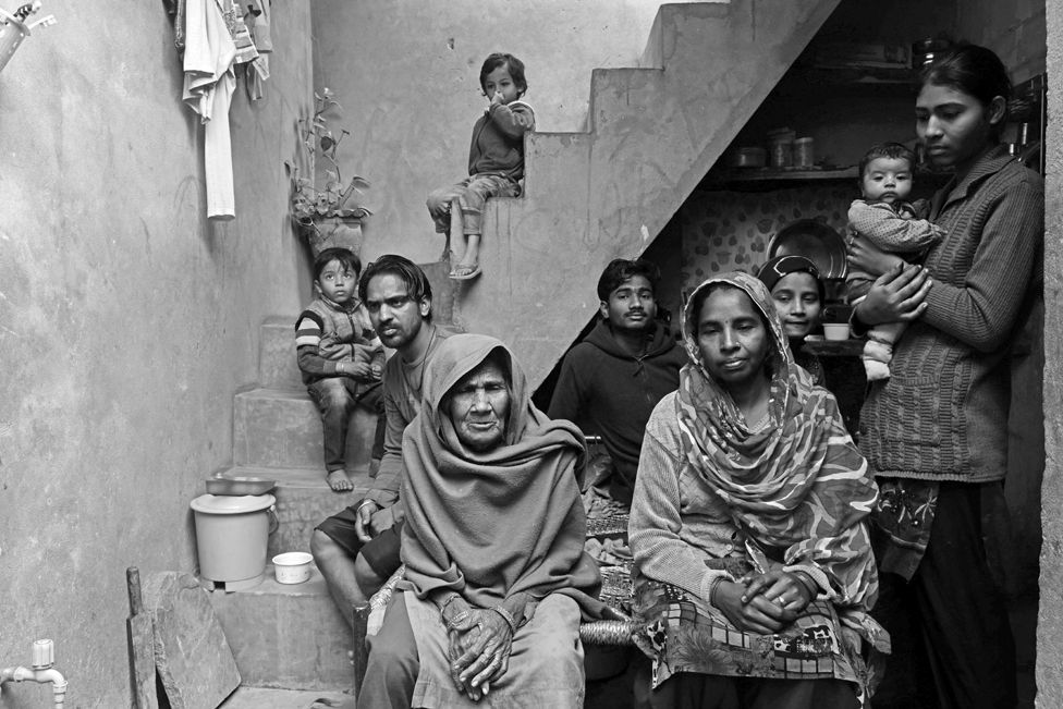 42-year-old Mukeshdevi, a woman manual scavenger, with her husband Sukhraj , mother in-law, five children and two grandchildren in Meerut's Bhagwatpura, India