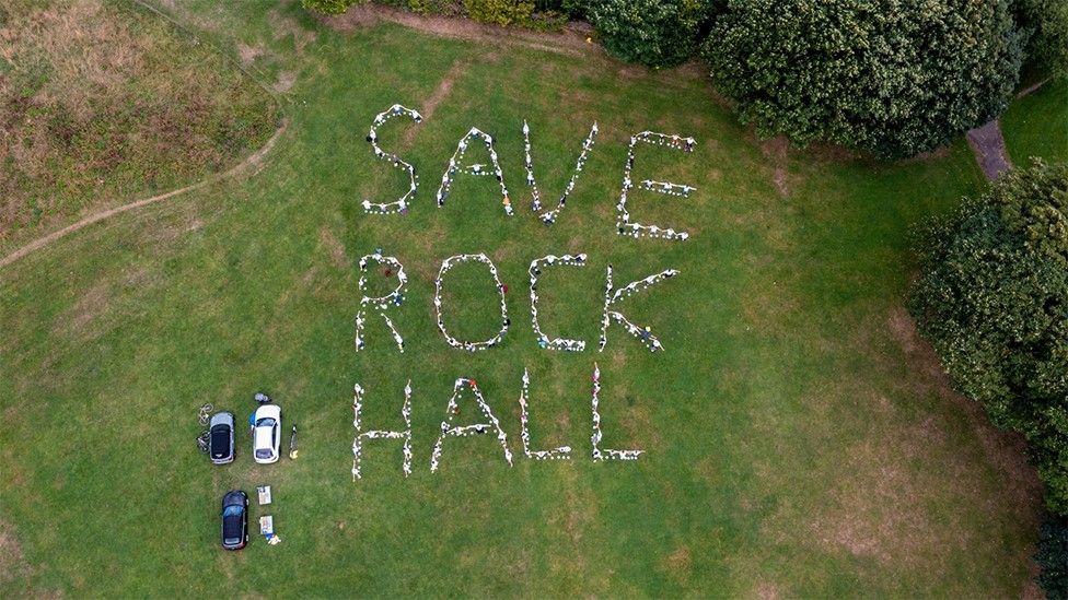 Aerial view of message Save Rock Hall on grass near Rock Hall