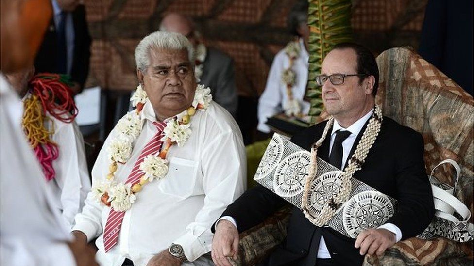French President Francois Hollande (R) attends a ceremony in Futuna island, on February 22, 2016, in the French overseas territory of the Wallis and Futuna Islands during a two-days visit.